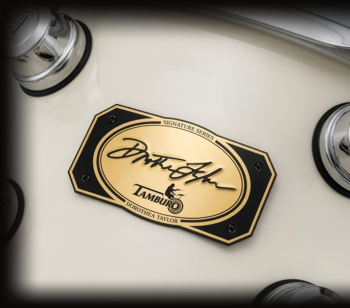 The gold Signature Series badge, signed by Dorothea Taylor, on the ivory shell